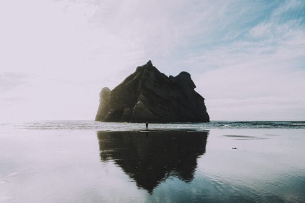 Man and a Rock in ocean