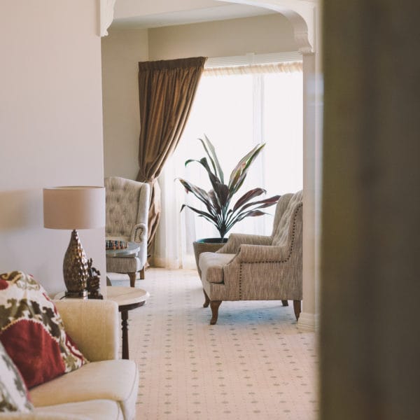 Big bedroom with soft chairs