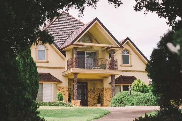 picture of house outlined by trees