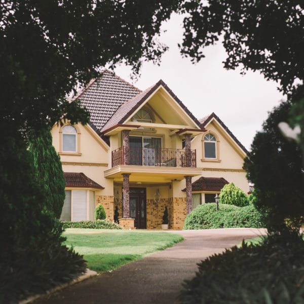 picture of house outlined by trees