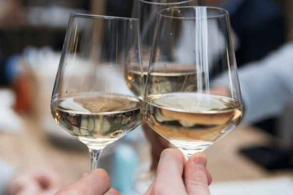 Three wine glasses cheersing