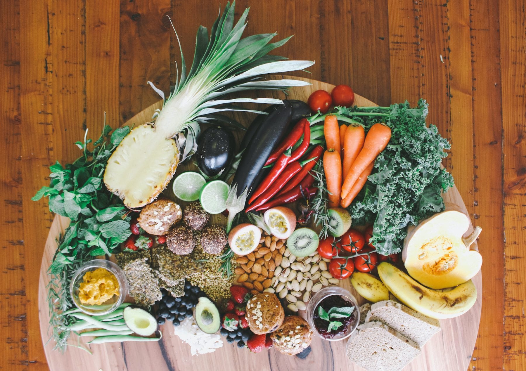 plate of fresh fruit, vegetables and nuts
