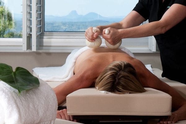 A woman getting a massage from The Banyans