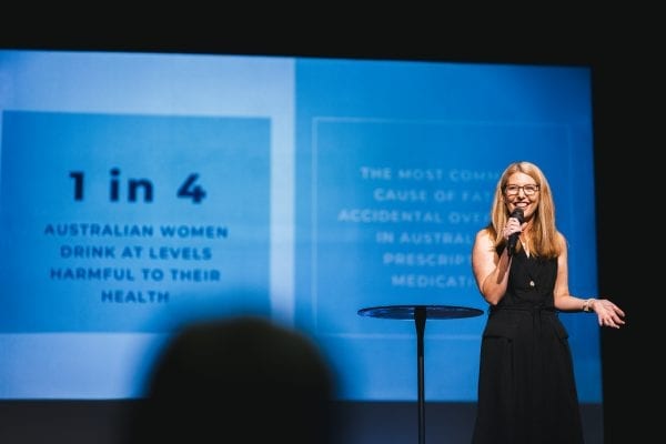 woman speaking at a conference