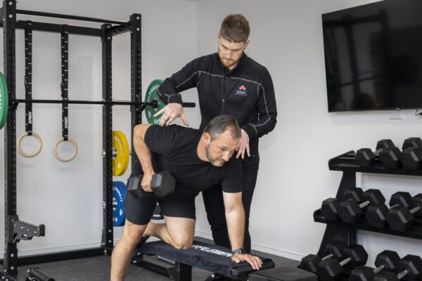 A man in The Banyans luxury rehab gym during an exercise physiology session