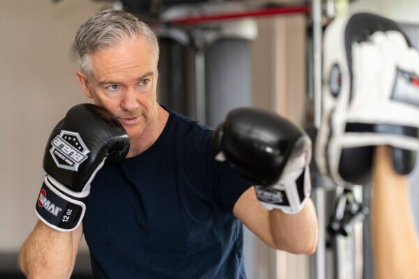 Photo of a man in an exercise therapy session at The Banyans luxury mental health retreat