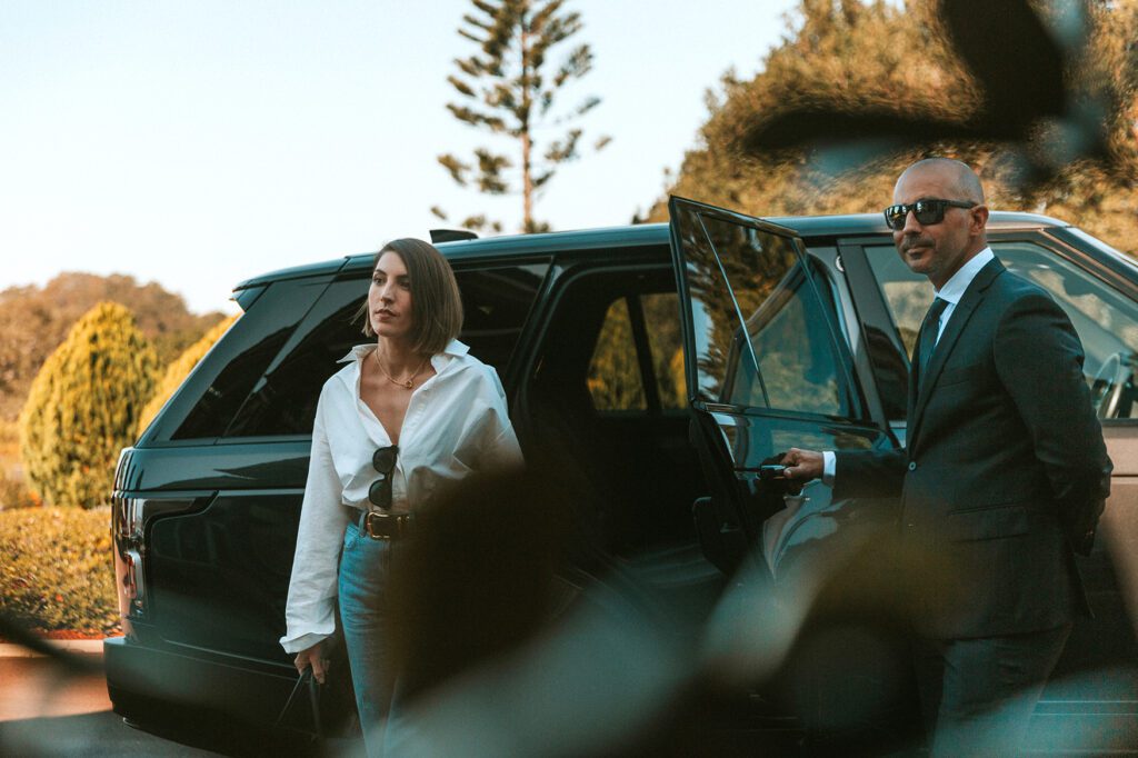 Female guest arriving via luxury executive transfer