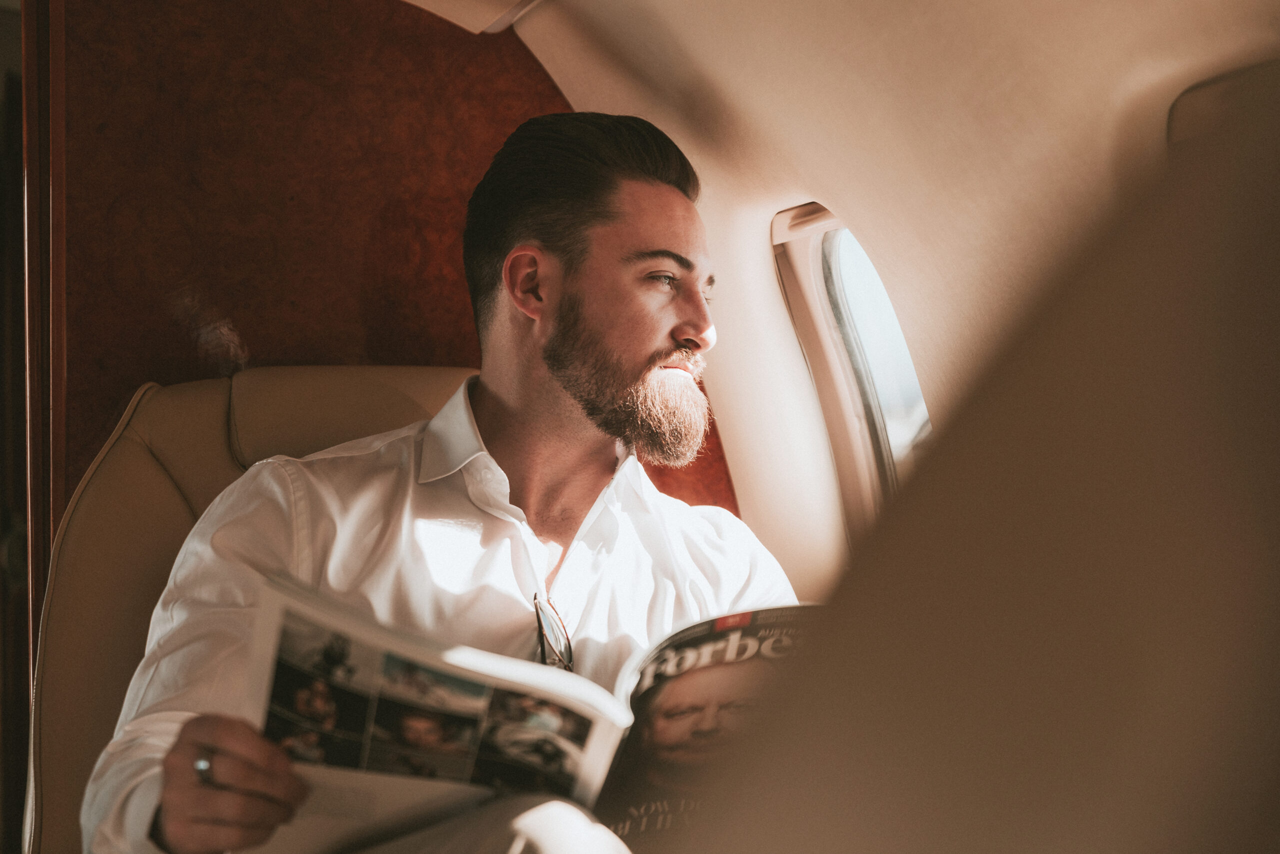 An executive from Melbourne sitting on the private jet travelling to The Banyans