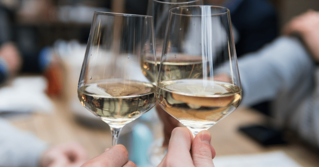 Three wine glasses cheersing