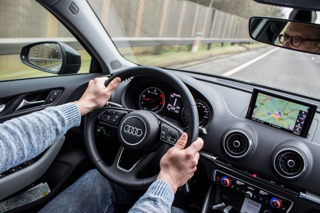 Image of someone driving a car under the influence which could be a sign of addiction behaviour