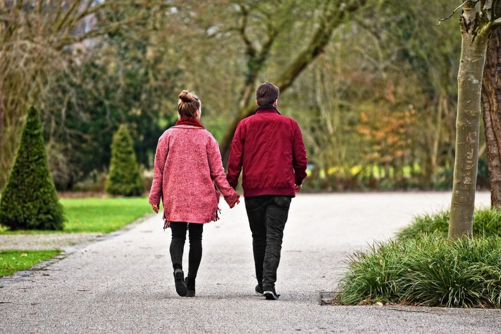 A loved one walking with their friend to help them with depression