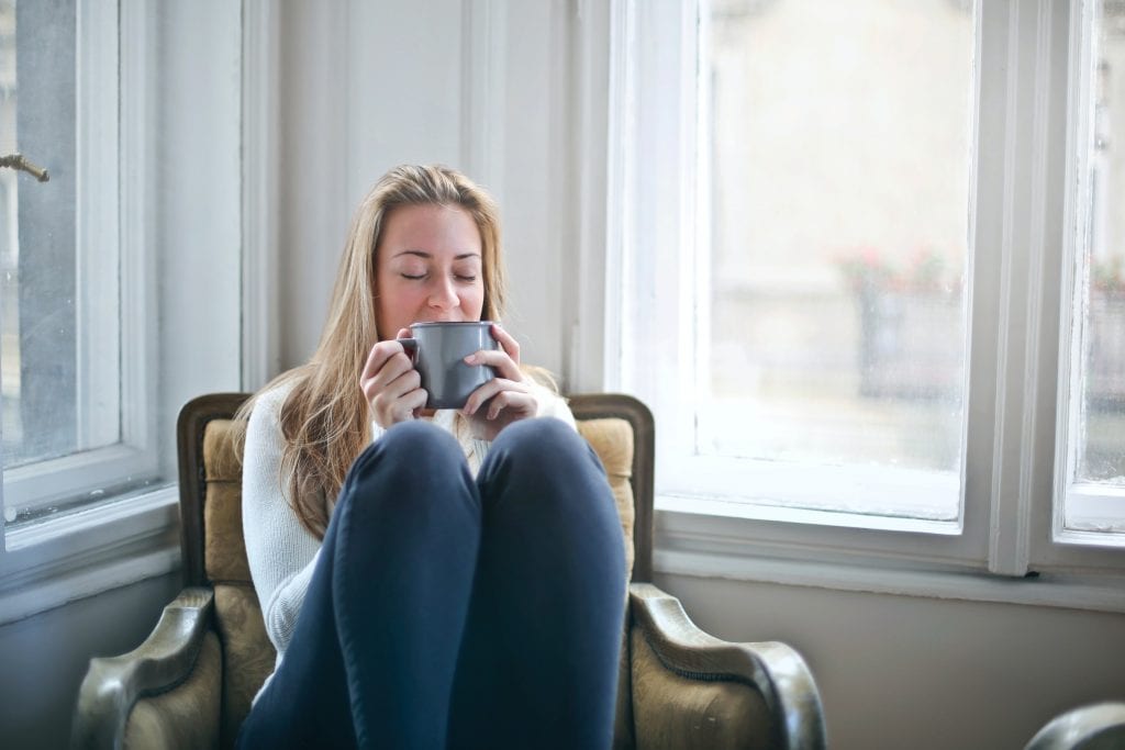 Lady sits at home and enjoys self-isolation