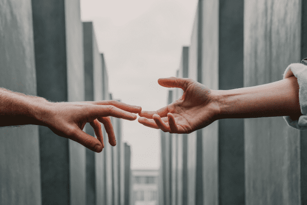 hands reaching out to eachother