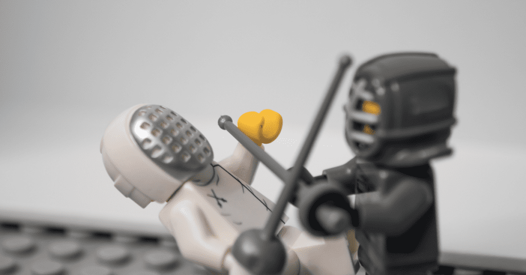 Two lego figurines fighting each other - representing the 'fight-or-flight' stress response