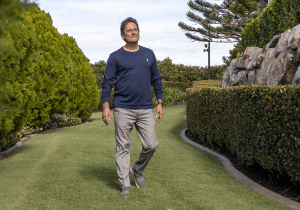 Man walking through garden