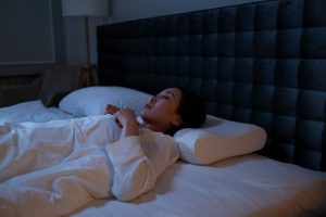 A woman showing signs of anxiety and unable to sleep