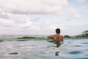 Guest swimming at The Banyans, Victoria's preferred wellness retreat