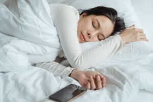 Image of woman sleeping well after treatment for insomnia